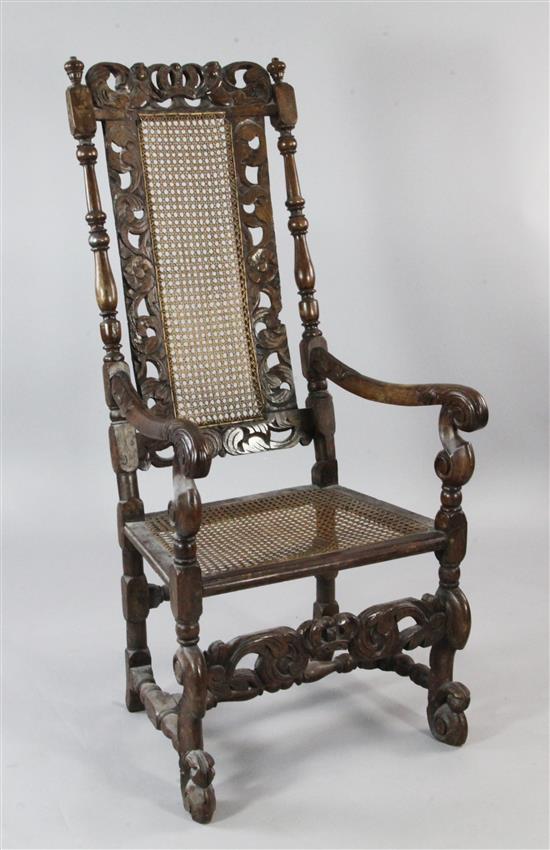 Carolean style beech and cane elbow chair